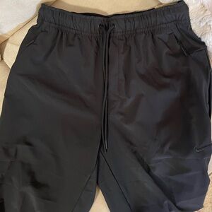 NWT Men’s Nike Unlimited Dri-Fit Joggers size S in black.